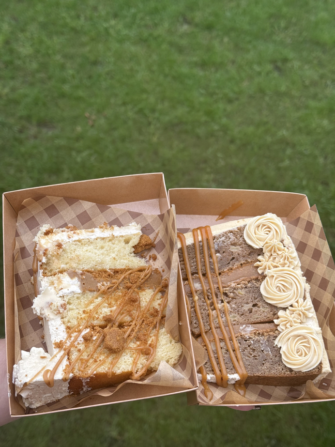Gourmet layered cake slice with frosting and caramel drizzle