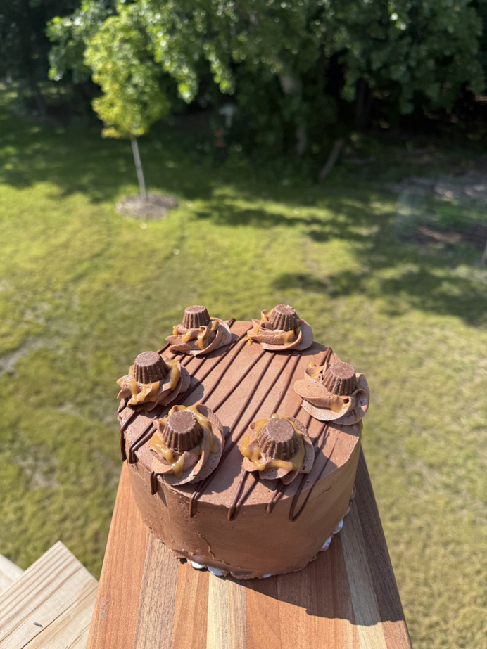 Small frosted celebration cake ready for a custom order